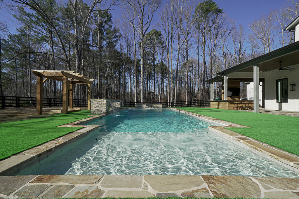 Backyard pool in backyard of Ecraft custom home