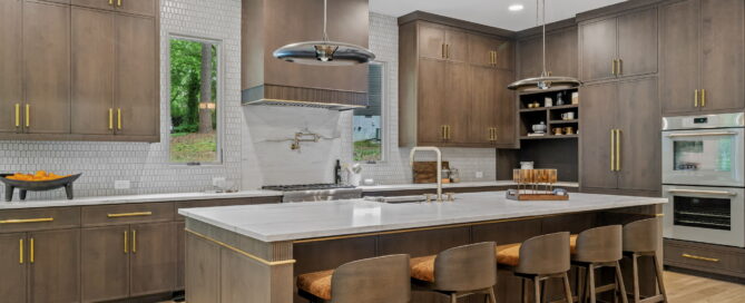 custom built home ecraft georgia custom kitchen with wood cabinets, island, and other luxury finishes