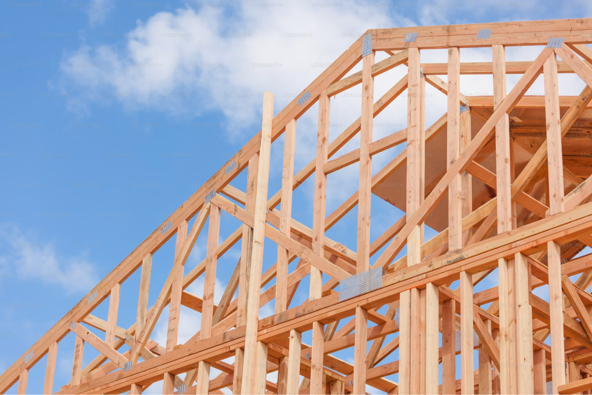 house framed with blue cloudy sky, building on your own lot Georgia